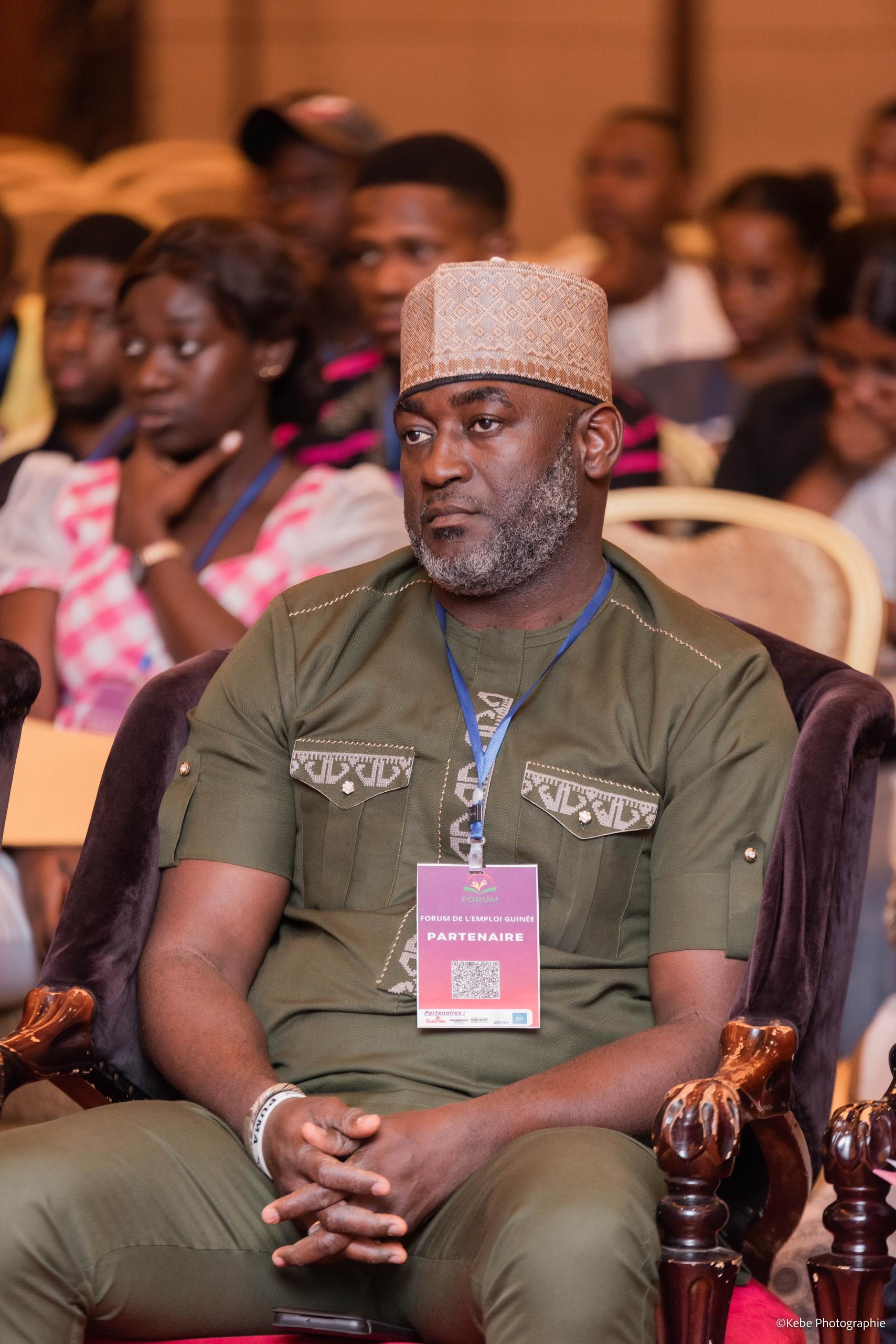 Participant attentif dans la salle, FEG 2025